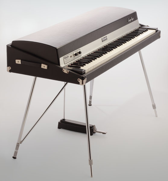 A Rhodes piano - an electric keyboard instrument encased in metal with a pedal.